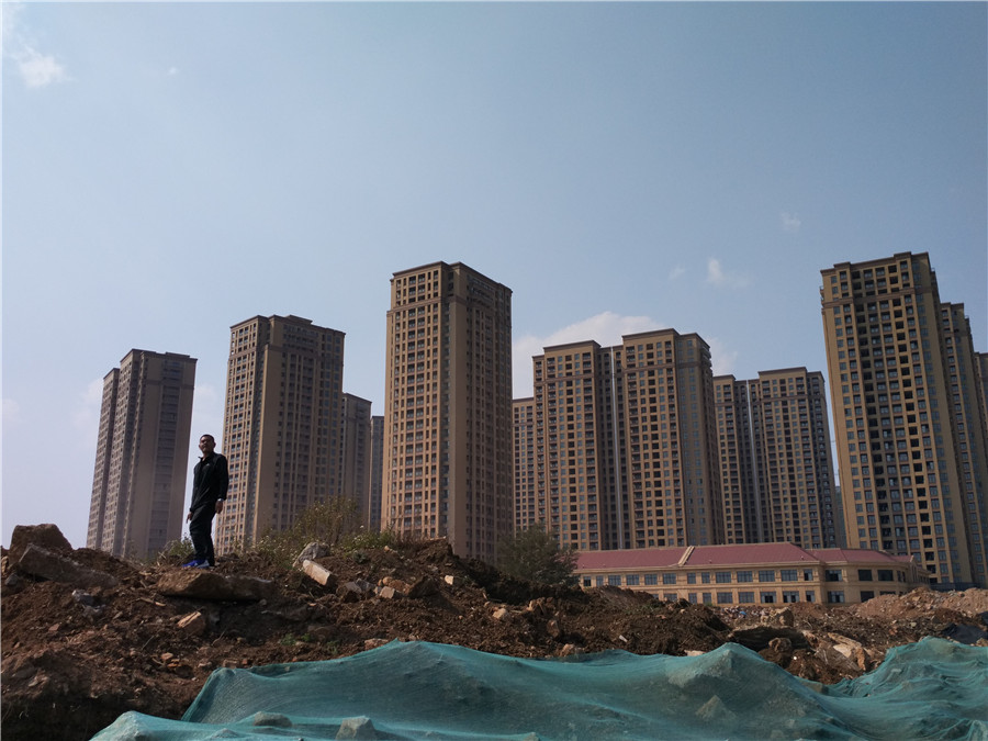 周偉都會到回遷房小區附近轉轉